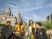 Universal Orlando Resort A family posing outside Hogwarts Castle in Universal Orlando Resort