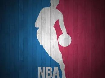 NBA logo with white outline of man dribbling a basketball with a red and blue wooden background.