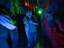 Guest in scare house at Universal Orlando Halloween Horror Nights