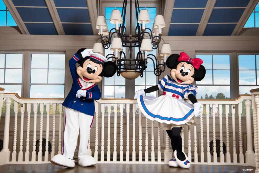 Mickey Mouse and Minnie Mouse posing in nautical-themed outfits