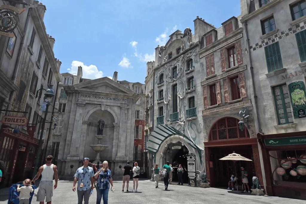 Wizarding World of Harry Potter – Ministry of Magic Large tall buildings with Parisian style creating a square where people can shop and cast spells.