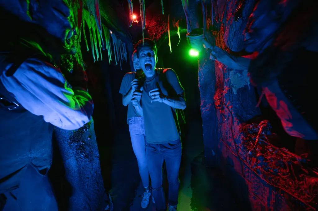 Halloween Horror Nights A boy in a haunted house at Halloween Horror Nights being scared