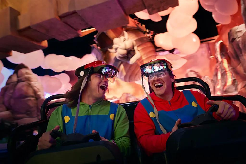 Mario Kart: Bowser's Challenge at Universal Epic Universe Two people dressed as Mario and Luigi on a Mario Kart attraction