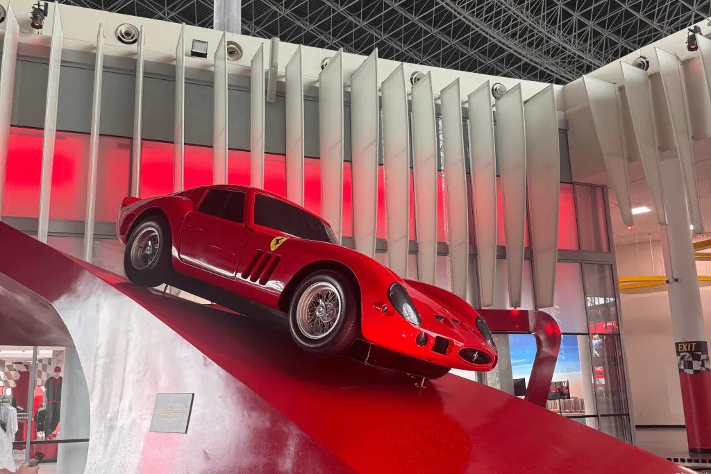 Ferrari World, Abu Dhabi A Ferrari model displayed on a red slope curving up towards the gift shop.