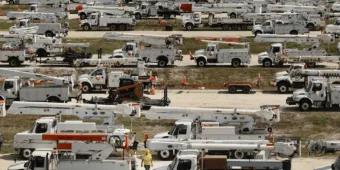 Long lines of emergency vehicles queued up ready to be used.