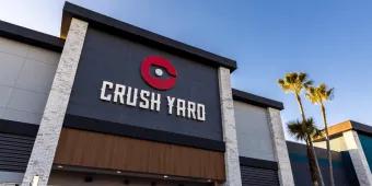Crush Yard A building which looks new and modern with a sign saying Crush on it and a paddleboard logo. Yard
