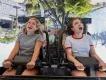 Jurassic World VelociCoaster Two young women with open mouths on an inversion on VelociCoaster