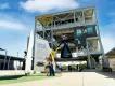 The Gantry at LC-39 A woman and young girl standing in front of a rocket experience at Kennedy Space Center