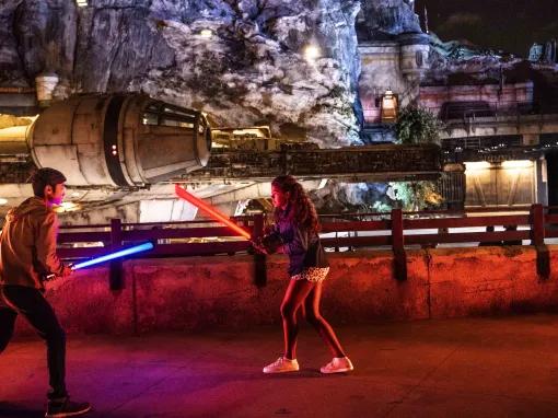 Kids playing with light sabres, Star Wars: Galaxy’s Edge at Disneyland Park in California