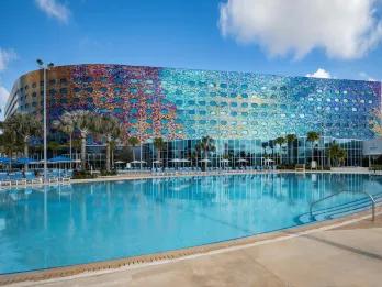 Exterior of Stella Nova and large pool. The outside is full of multi-coloured mosaic tiles of different colours.